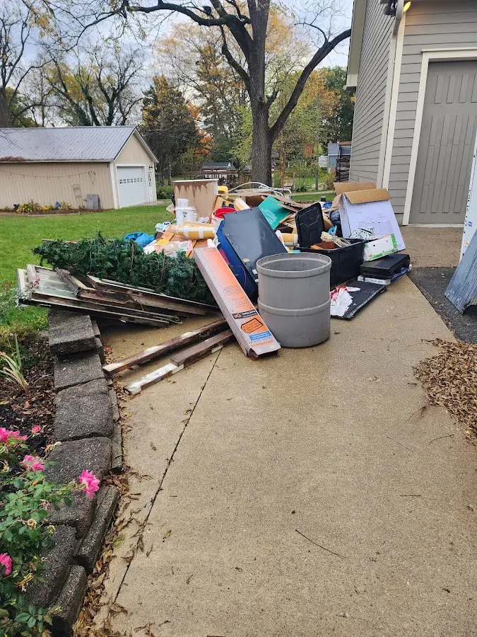 Dumpster being loaded with debris for Estate Cleanout Dumpster Rental in Silverton